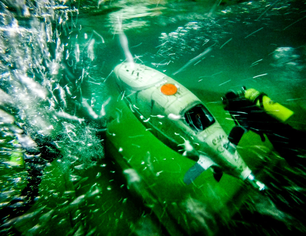 robot and diver underwater